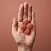 creatine gummies in a woman's hand
